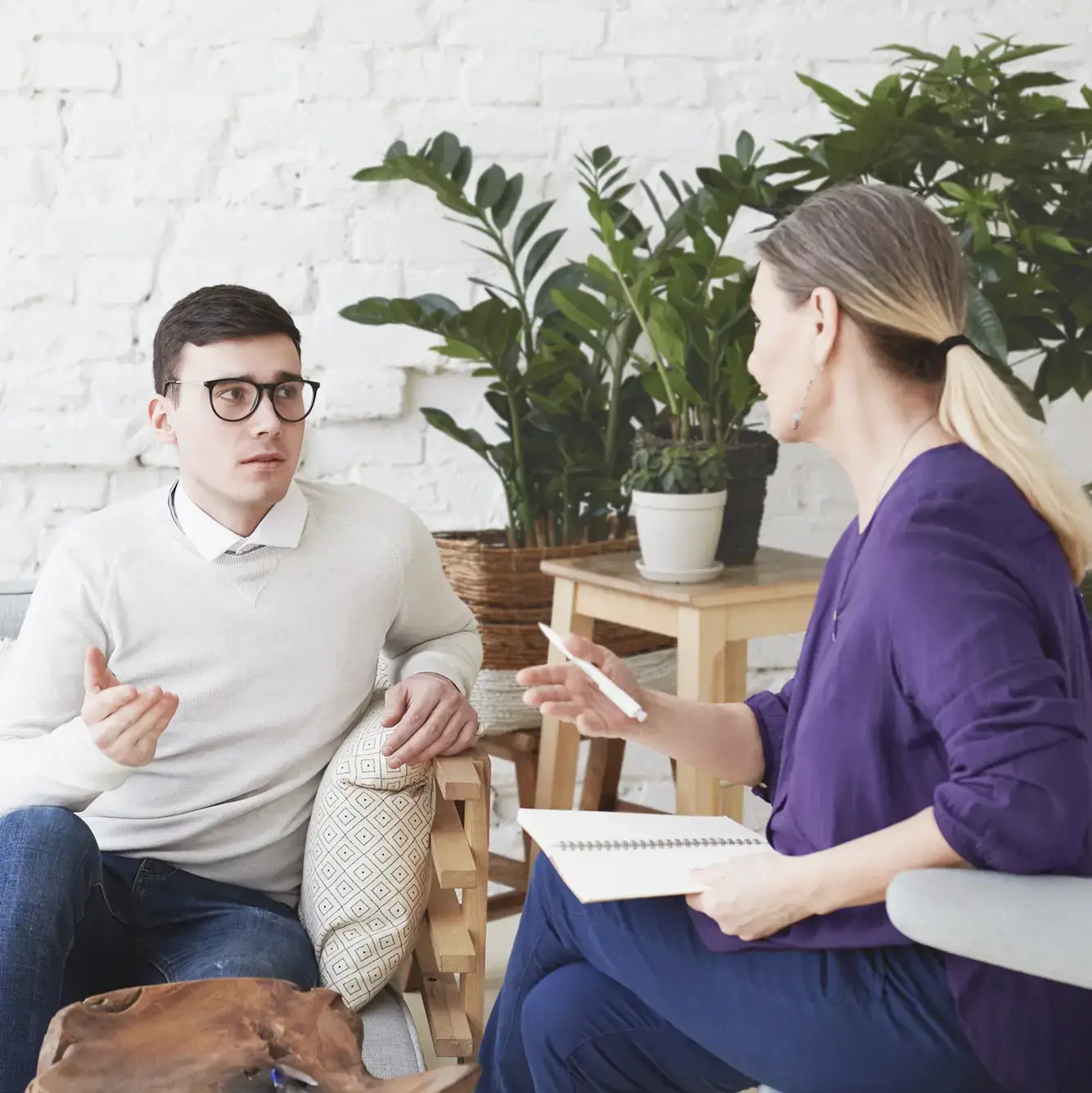 a male client talking with a female therapist