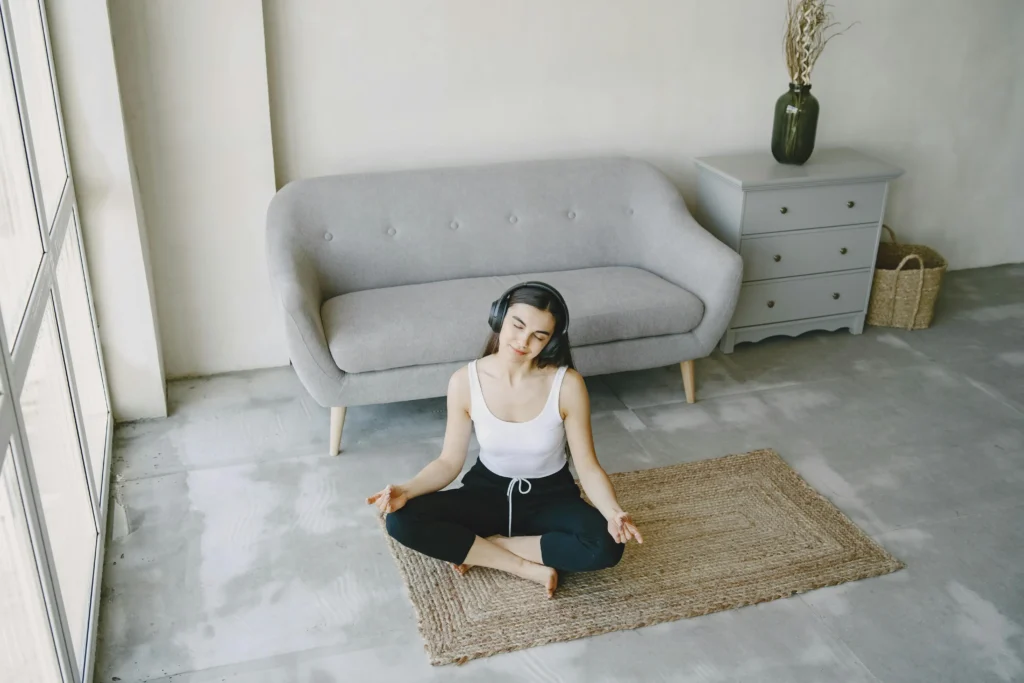 a woman practice meditation on the yoga mat