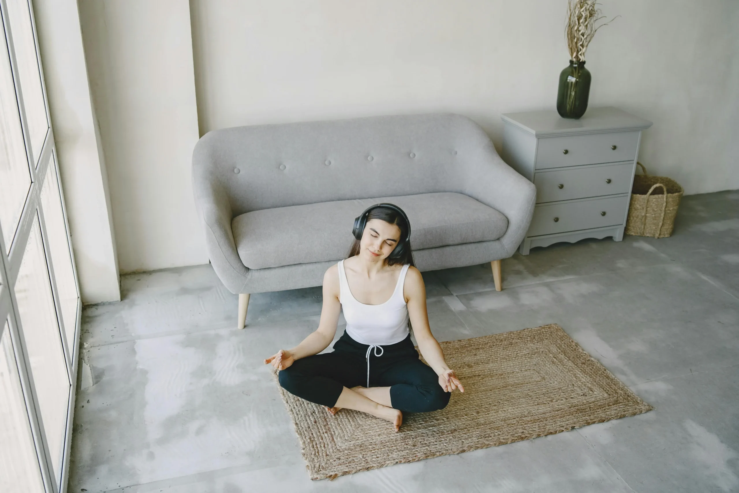 a woman practice meditation on the yoga mat